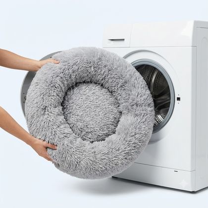The bed being loaded into a washing machine